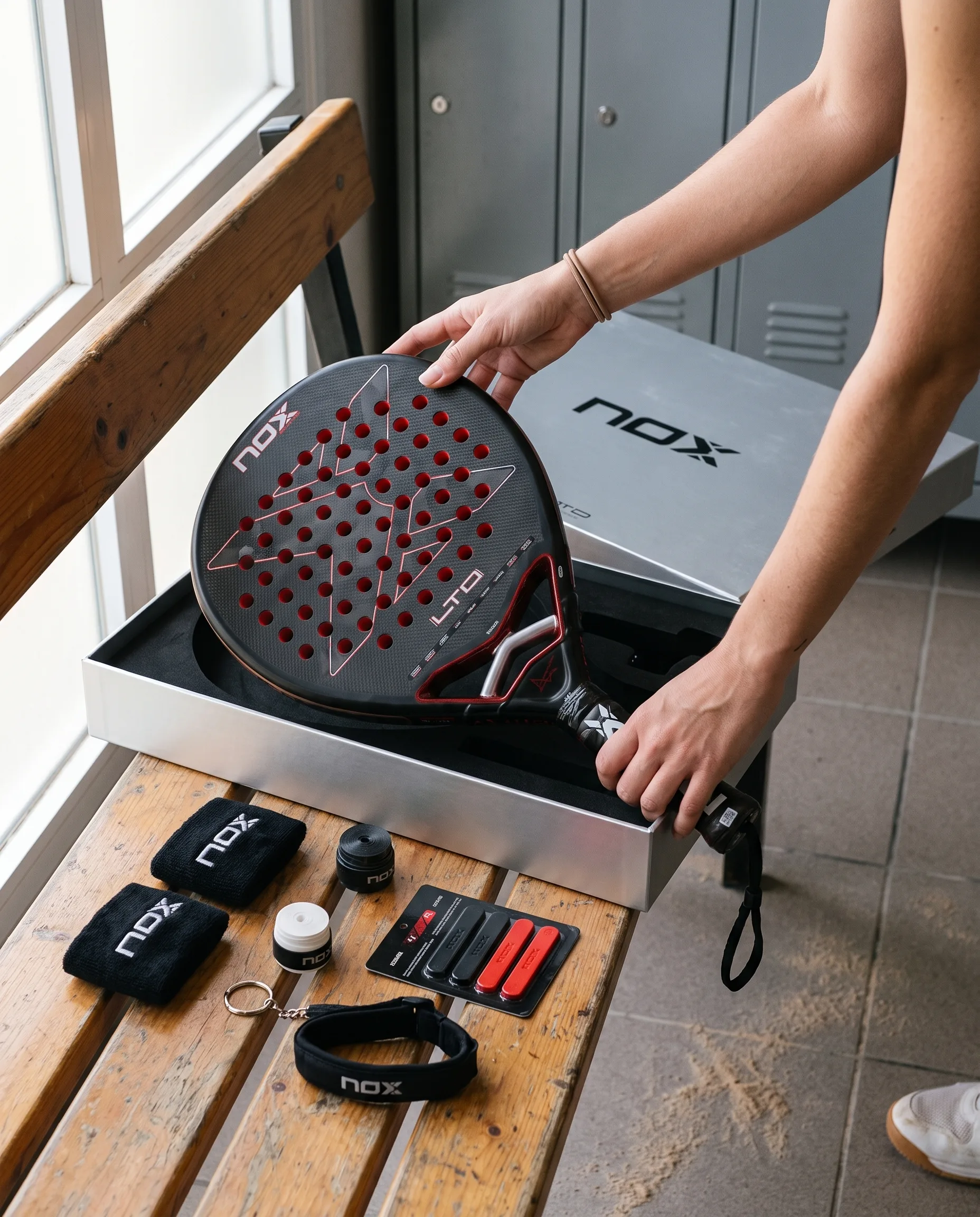Unboxing the Nox AT10 Genius 12K Xtreme Limited Edition: the racket lifted from its silver box, kit laid out on the bench